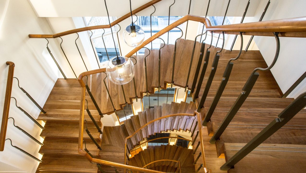 American Cherry wood offset against stone staircase, Welbeck Street, Mayfair by PT Handrails at Clive Durose staircase company